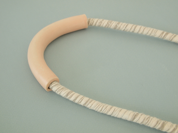YYY tube necklace on variegated cord YYY tube necklace on variegated cord