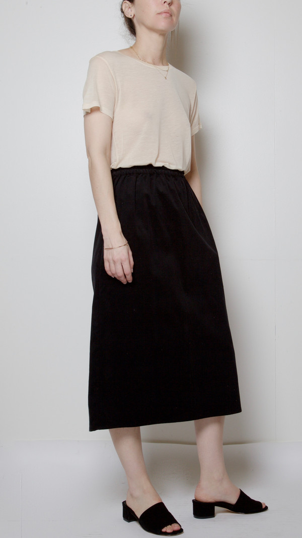 Baserange Fine Corduroy Jogging Skirt in Black Baserange Fine Corduroy Jogging Skirt in Black