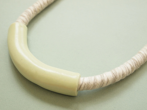 YYY short tube necklace on variegated cord YYY short tube necklace on variegated cord